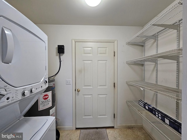 washroom featuring stacked washer / dryer