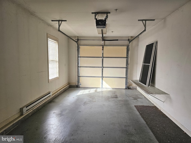 garage with a garage door opener and baseboard heating