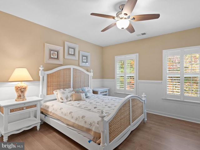 bedroom featuring hardwood / wood-style flooring and ceiling fan