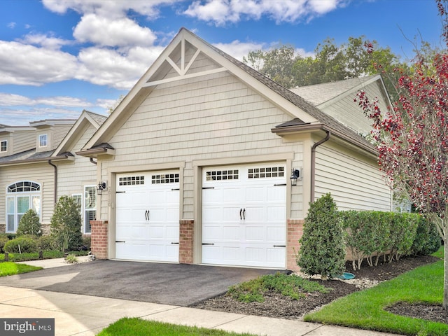 view of side of home featuring a garage