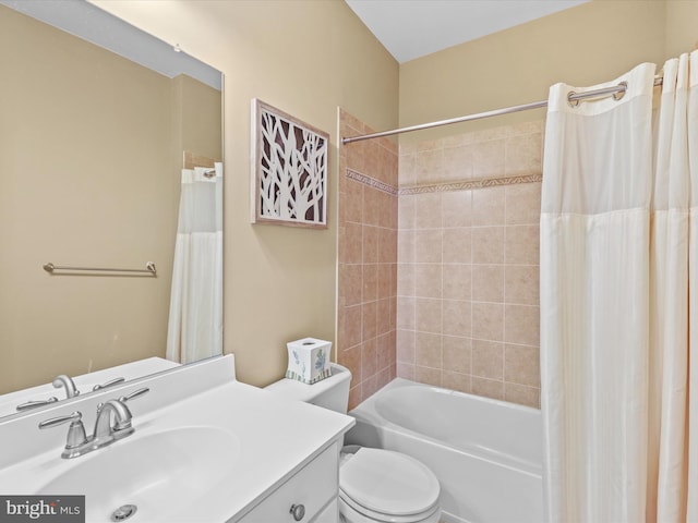 full bathroom with vanity, toilet, and shower / tub combo with curtain