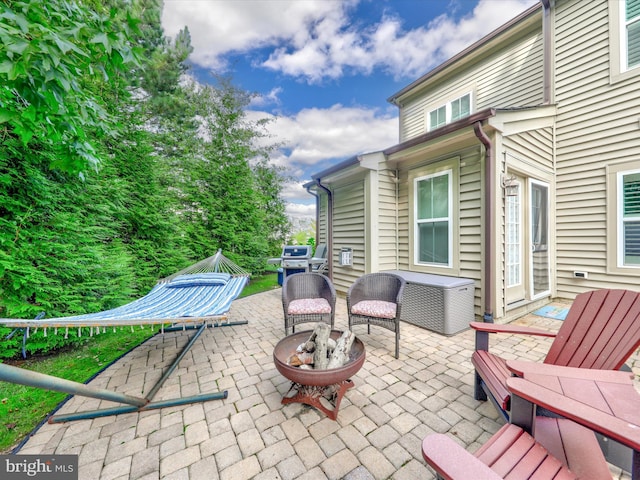 view of patio / terrace featuring a fire pit