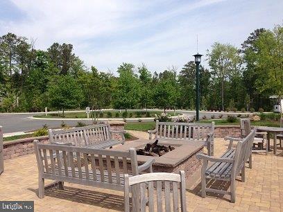 view of patio / terrace featuring an outdoor fire pit