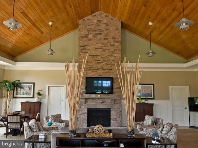 carpeted living room with ornamental molding, a stone fireplace, wooden ceiling, and high vaulted ceiling