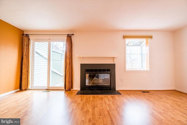 unfurnished living room featuring hardwood / wood-style floors