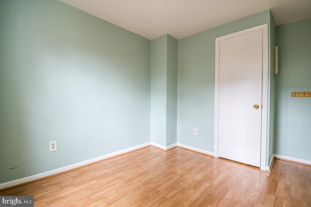 spare room featuring light hardwood / wood-style flooring