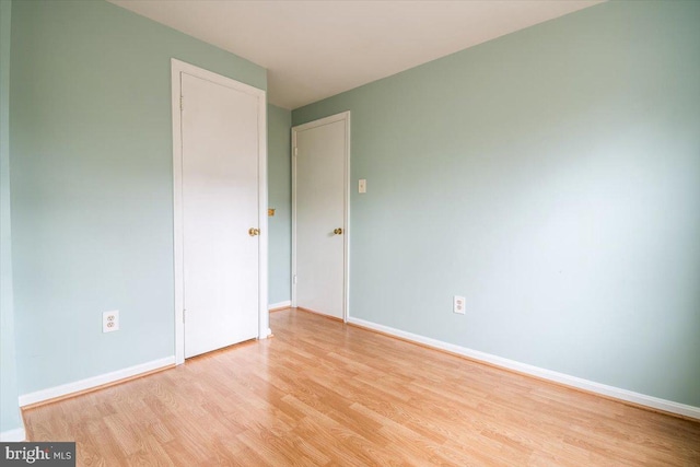 spare room featuring light hardwood / wood-style flooring