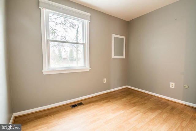 unfurnished room featuring light hardwood / wood-style floors