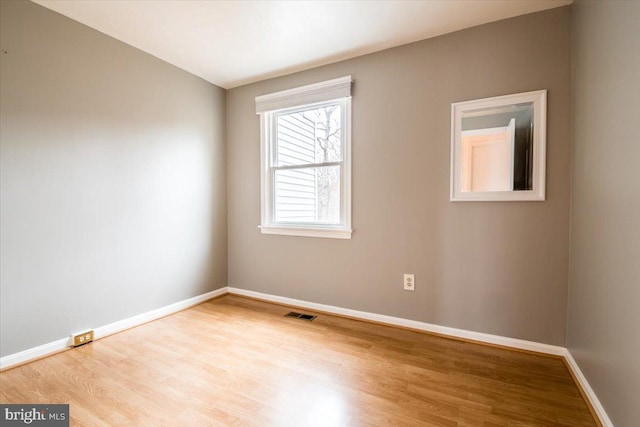 empty room with light wood-type flooring