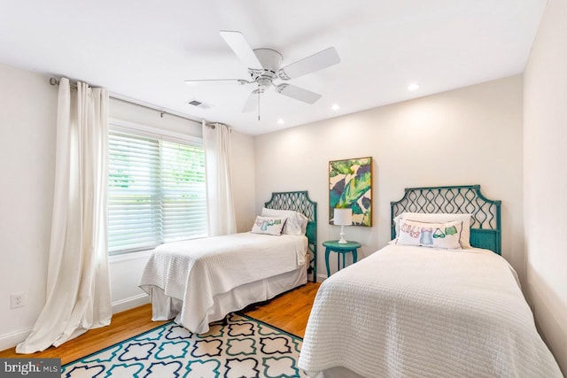 bedroom featuring ceiling fan and light hardwood / wood-style flooring