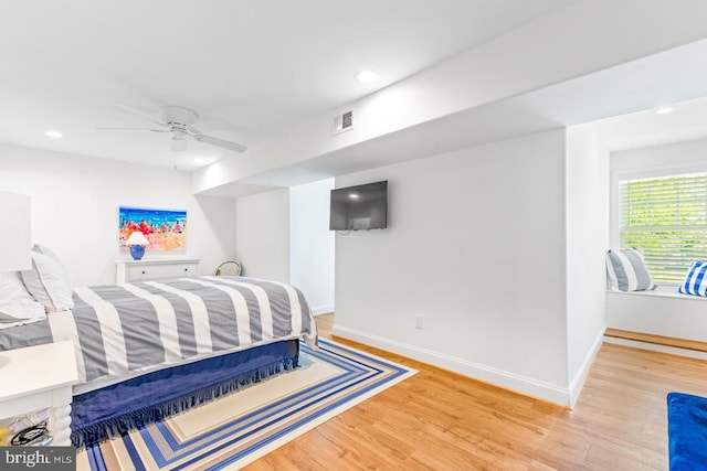 bedroom featuring ceiling fan and light hardwood / wood-style floors