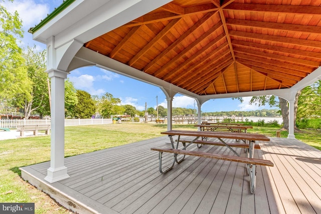 wooden terrace featuring a gazebo and a yard