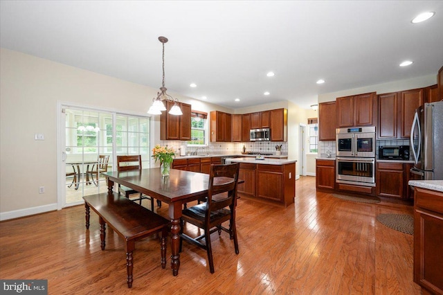 11050 Sanandrew Dr, New Market, MD 21774 - dining space with wood finished floors, recessed lighting, baseboards, and a chandelier