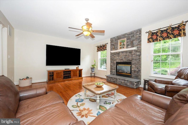11050 Sanandrew Dr, New Market, MD 21774 - living room featuring a fireplace, wood finished floors, a ceiling fan, and baseboards