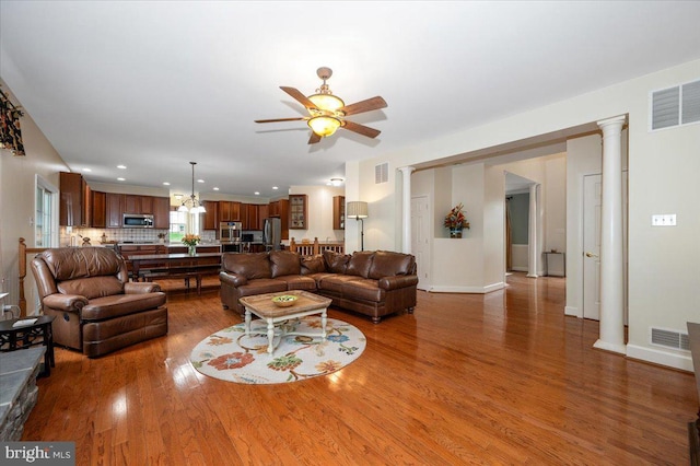11050 Sanandrew Dr, New Market, MD 21774 - living area with wood finished floors, ceiling fan, recessed lighting, and baseboards