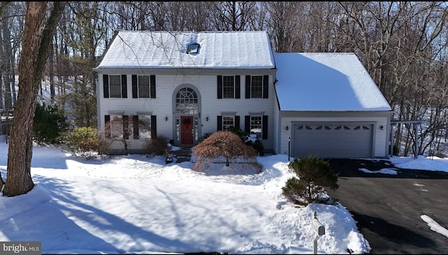 colonial-style house featuring a garage