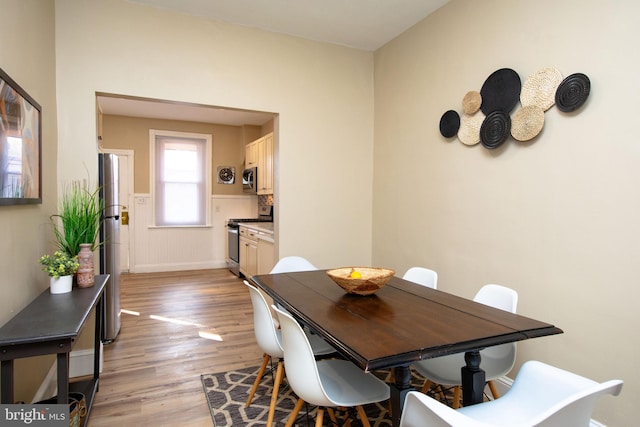 dining area featuring light wood-type flooring