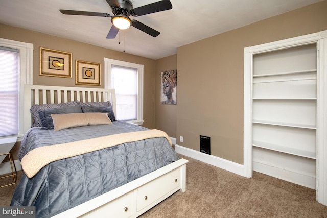 carpeted bedroom with ceiling fan