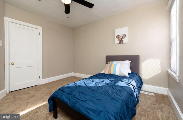 carpeted bedroom featuring ceiling fan