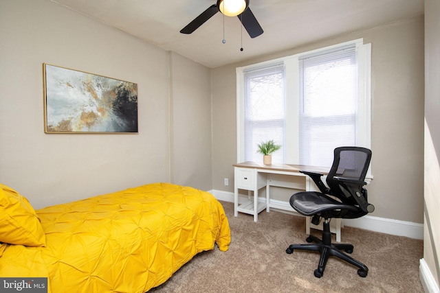 carpeted bedroom with ceiling fan