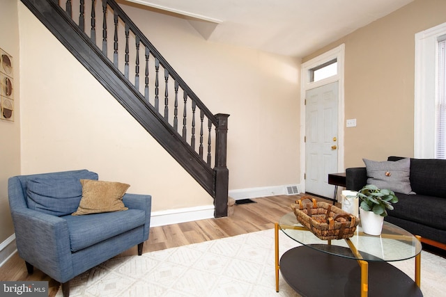 living room with light hardwood / wood-style flooring