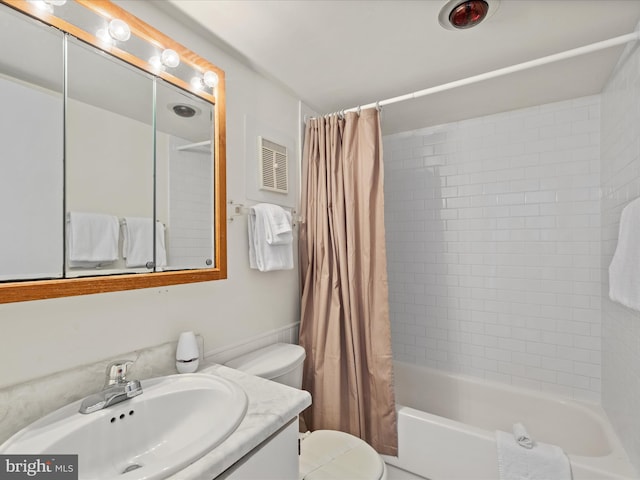 full bathroom featuring vanity, shower / bath combination with curtain, and toilet