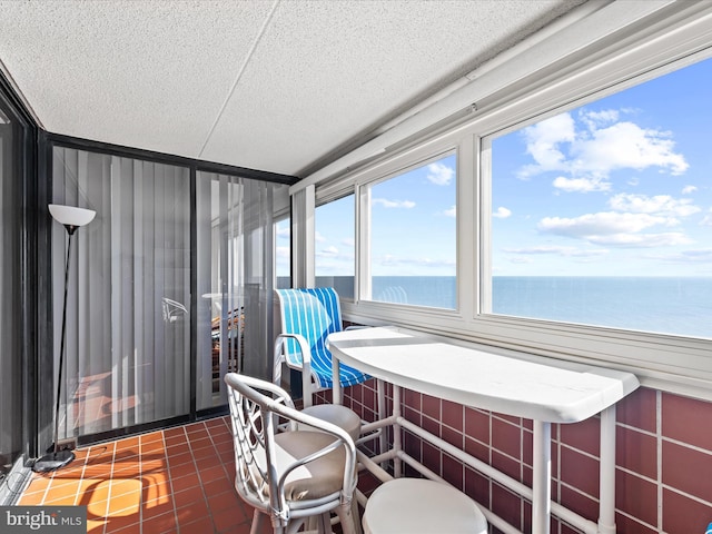 sunroom with a water view