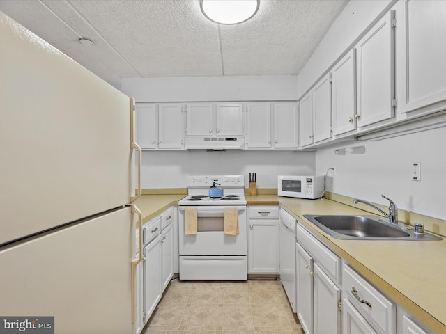 kitchen with white cabinetry, white appliances, sink, and a textured ceiling