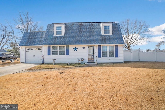 cape cod-style house featuring a garage and a front lawn