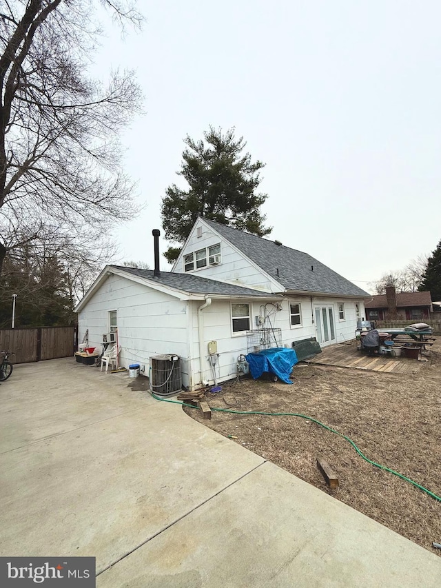 back of property featuring a patio area and central air condition unit