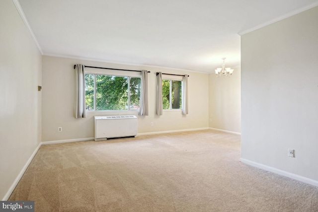 unfurnished room featuring light carpet, radiator, crown molding, and a chandelier