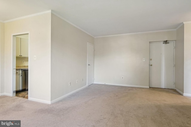 spare room with crown molding and light colored carpet