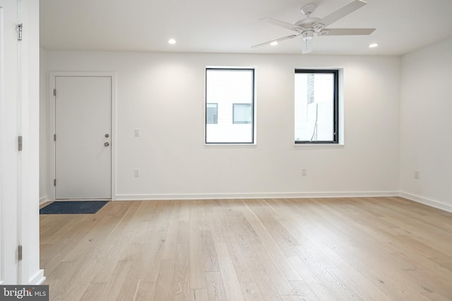 empty room featuring ceiling fan and light wood-type flooring