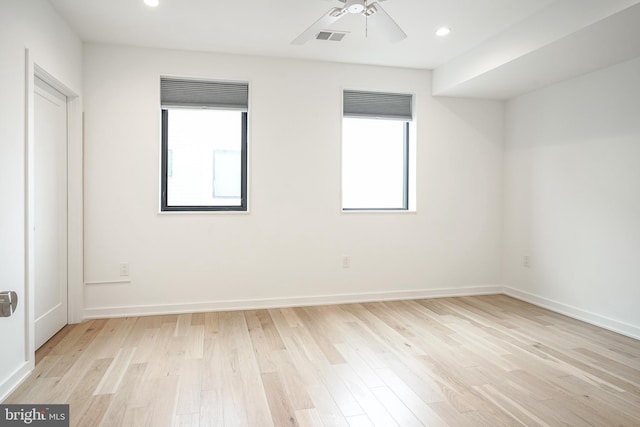 spare room with ceiling fan and light hardwood / wood-style floors