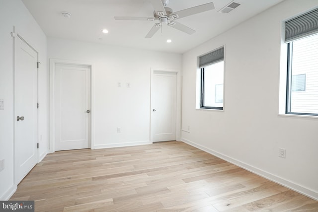 unfurnished bedroom with light hardwood / wood-style floors and ceiling fan