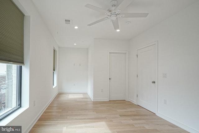 spare room with ceiling fan and light hardwood / wood-style flooring