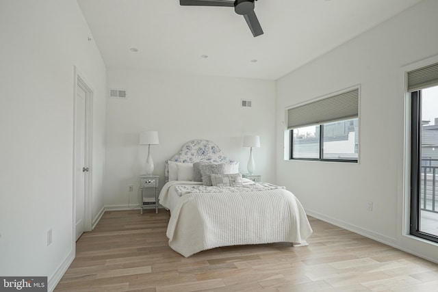 bedroom with ceiling fan and light hardwood / wood-style flooring