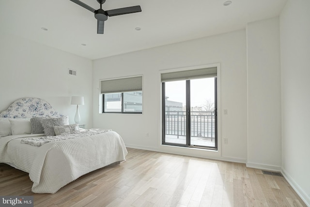 bedroom featuring ceiling fan, access to outside, and light hardwood / wood-style floors