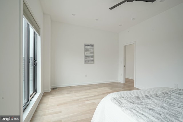 bedroom featuring light hardwood / wood-style flooring and ceiling fan