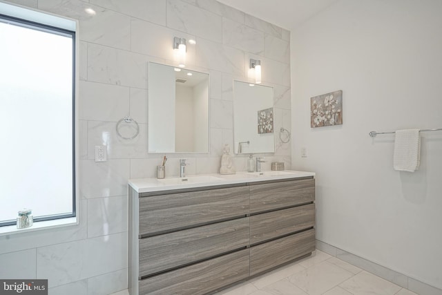 bathroom featuring tile walls and vanity