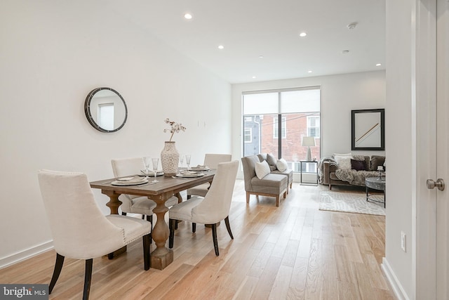 dining area with light hardwood / wood-style flooring