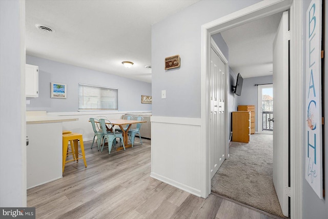 hallway featuring light hardwood / wood-style flooring