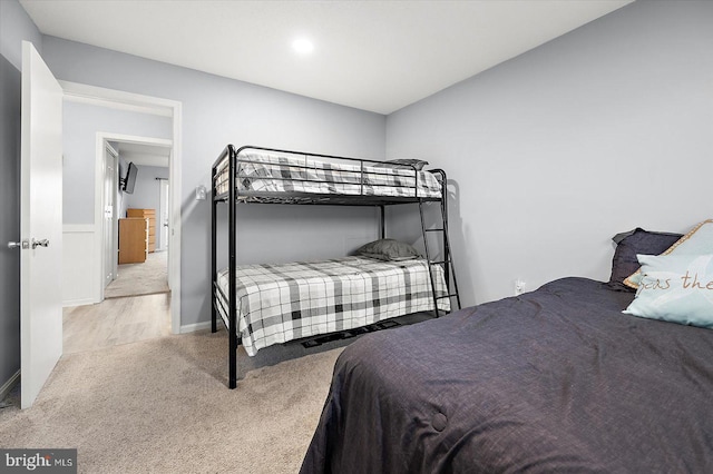 bedroom with light colored carpet