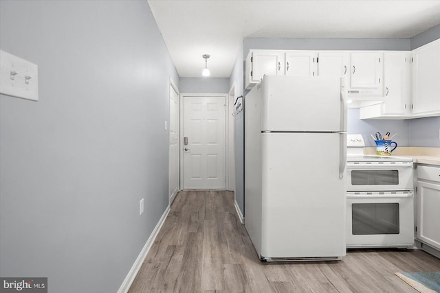 kitchen featuring white appliances, light hardwood / wood-style flooring, and white cabinets