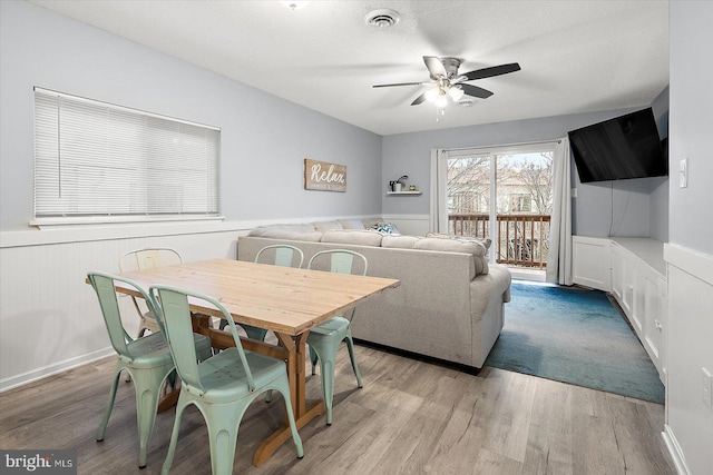 dining room featuring ceiling fan and light wood-type flooring