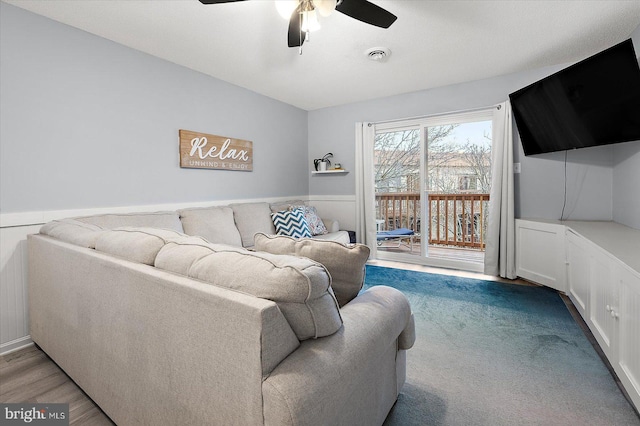 living room with ceiling fan and light hardwood / wood-style floors