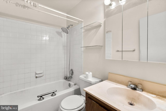 full bathroom with tiled shower / bath combo, vanity, and toilet