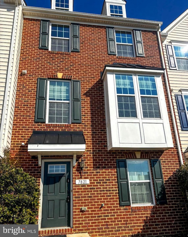 view of property with brick siding