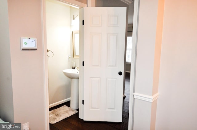 bathroom with sink and hardwood / wood-style floors