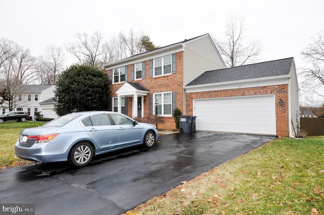 view of front of house featuring a garage and a front yard